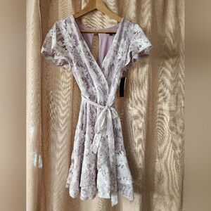 Lilac and White Lace Wrap Dress with Ruffled Skirt. Size 7. NWT